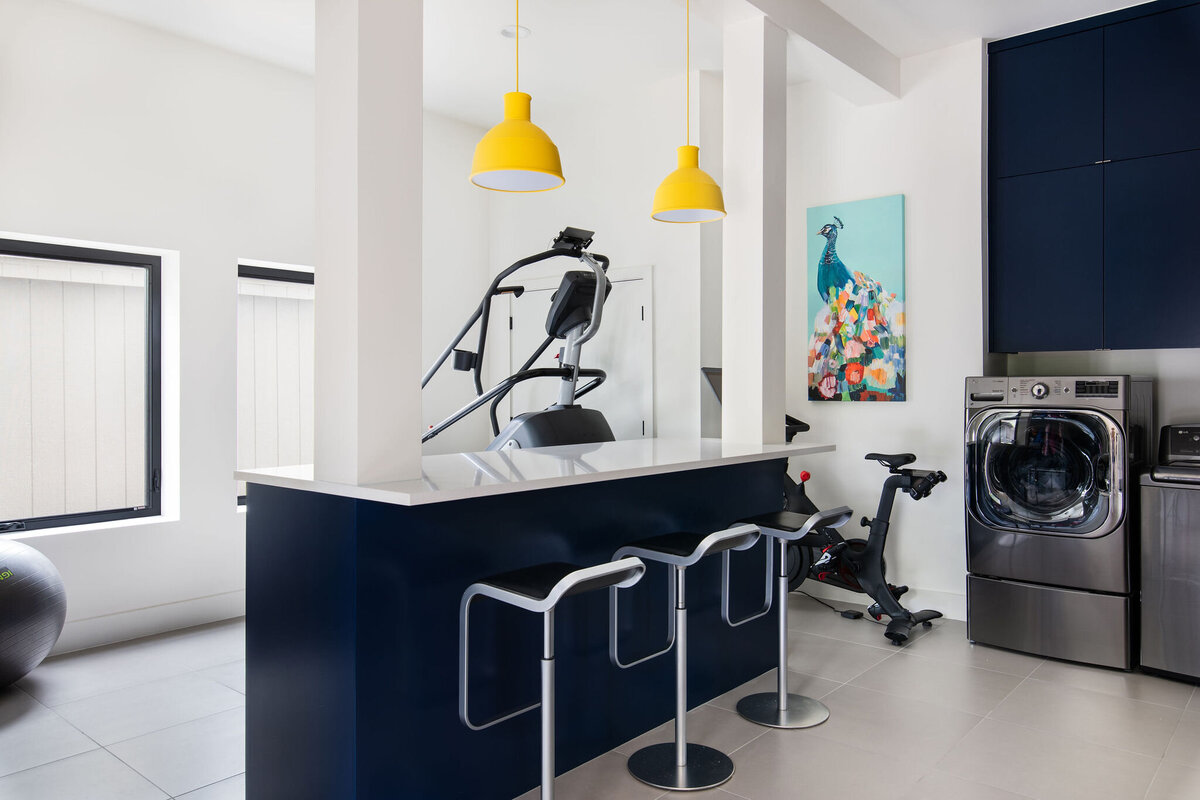hello-home-modern-navy-cabinetry-multi-functional-home-gym-laundry-room-design-14