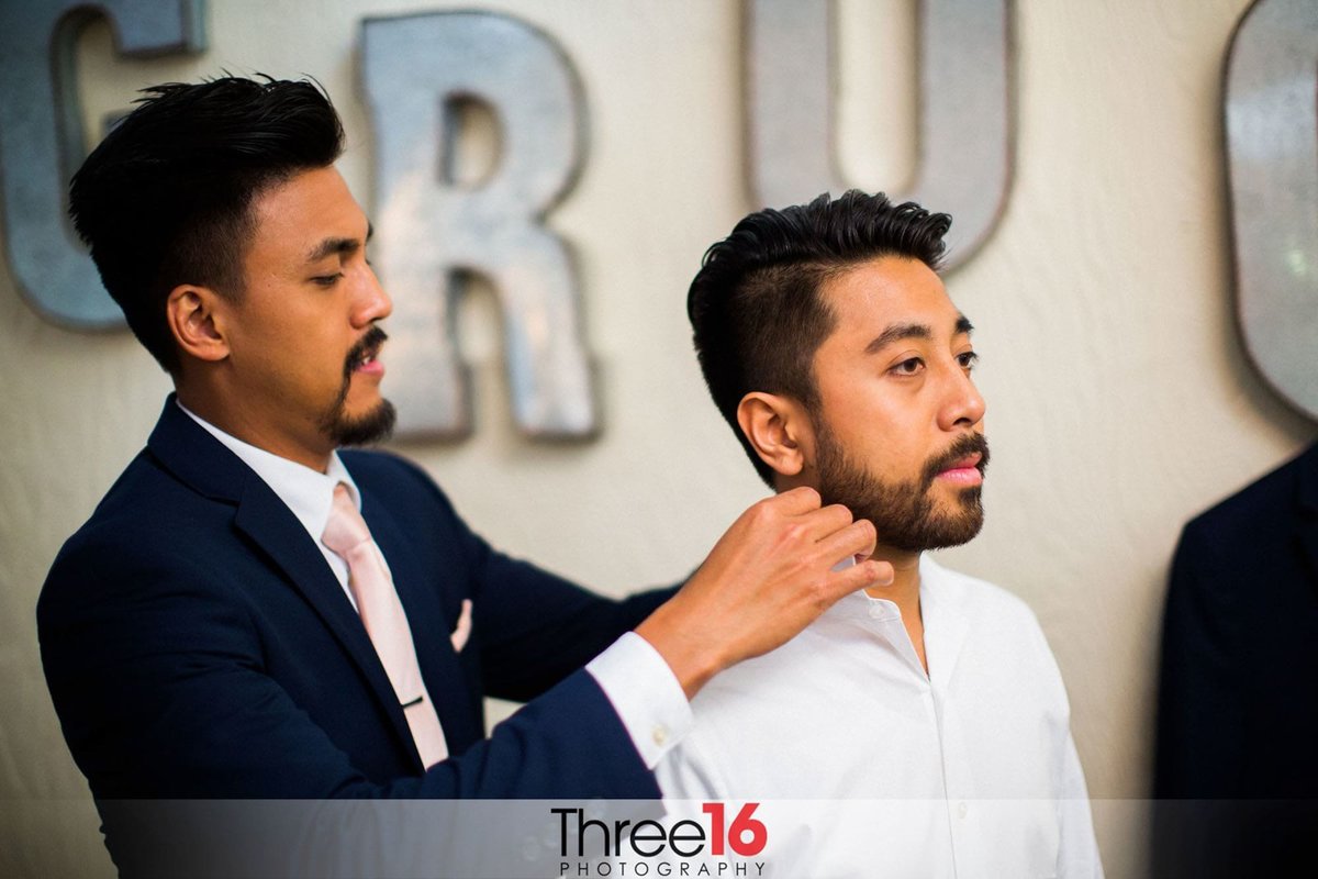 Groom getting the final touches as he gets ready for the ceremony