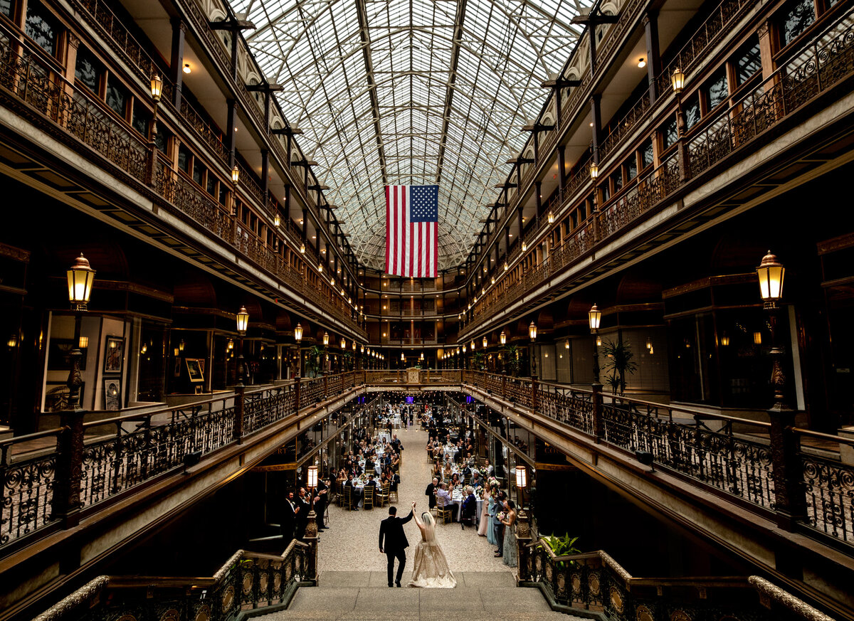 A couple enters the reception at the historic Hyatt Arcade in Cleveland.