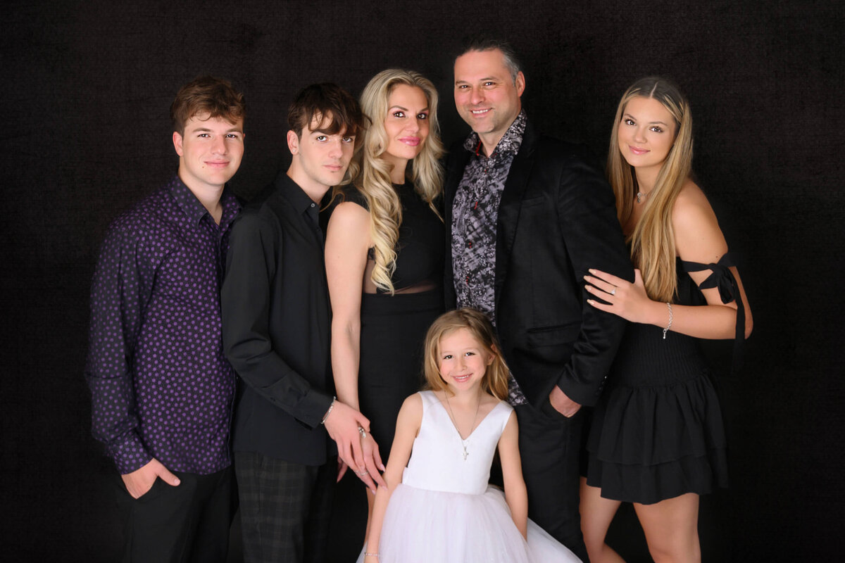 Mom and dad with their two sons and two daughters for their formal studio Burlington Photographer Session