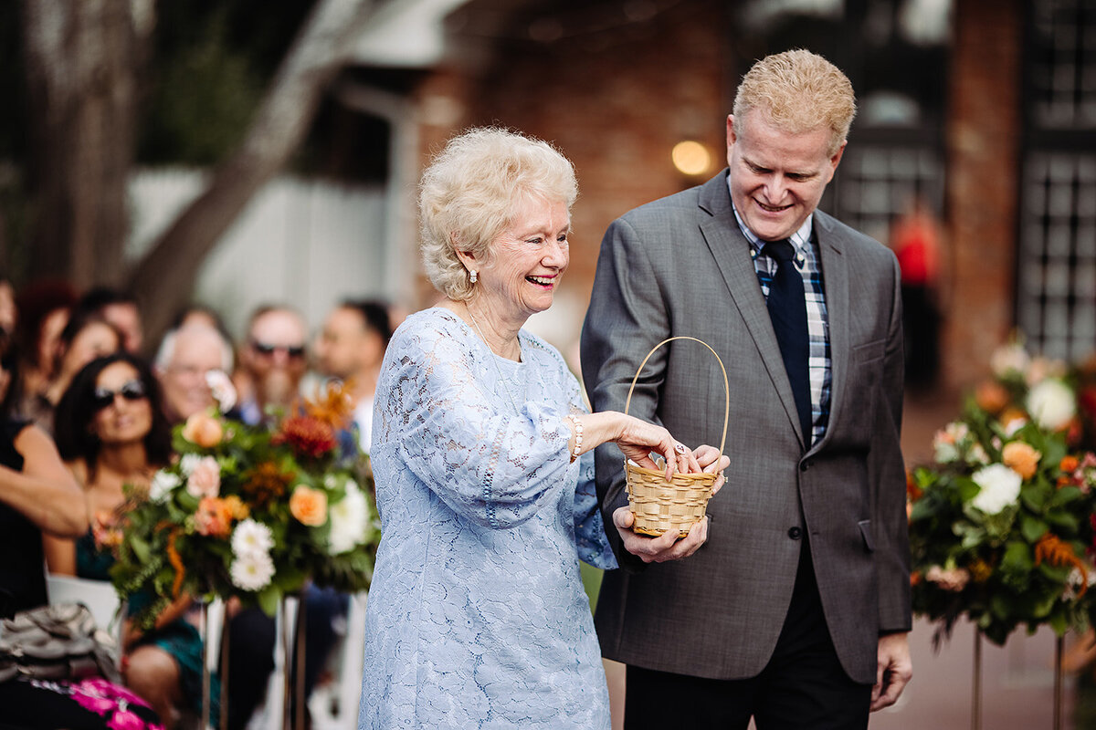 Grandma going down the aisle as a flower girl.
