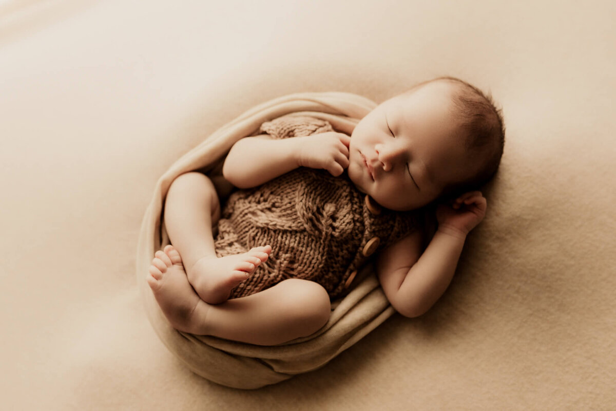 Newborn portrait of a baby boy swaddled  in OKC