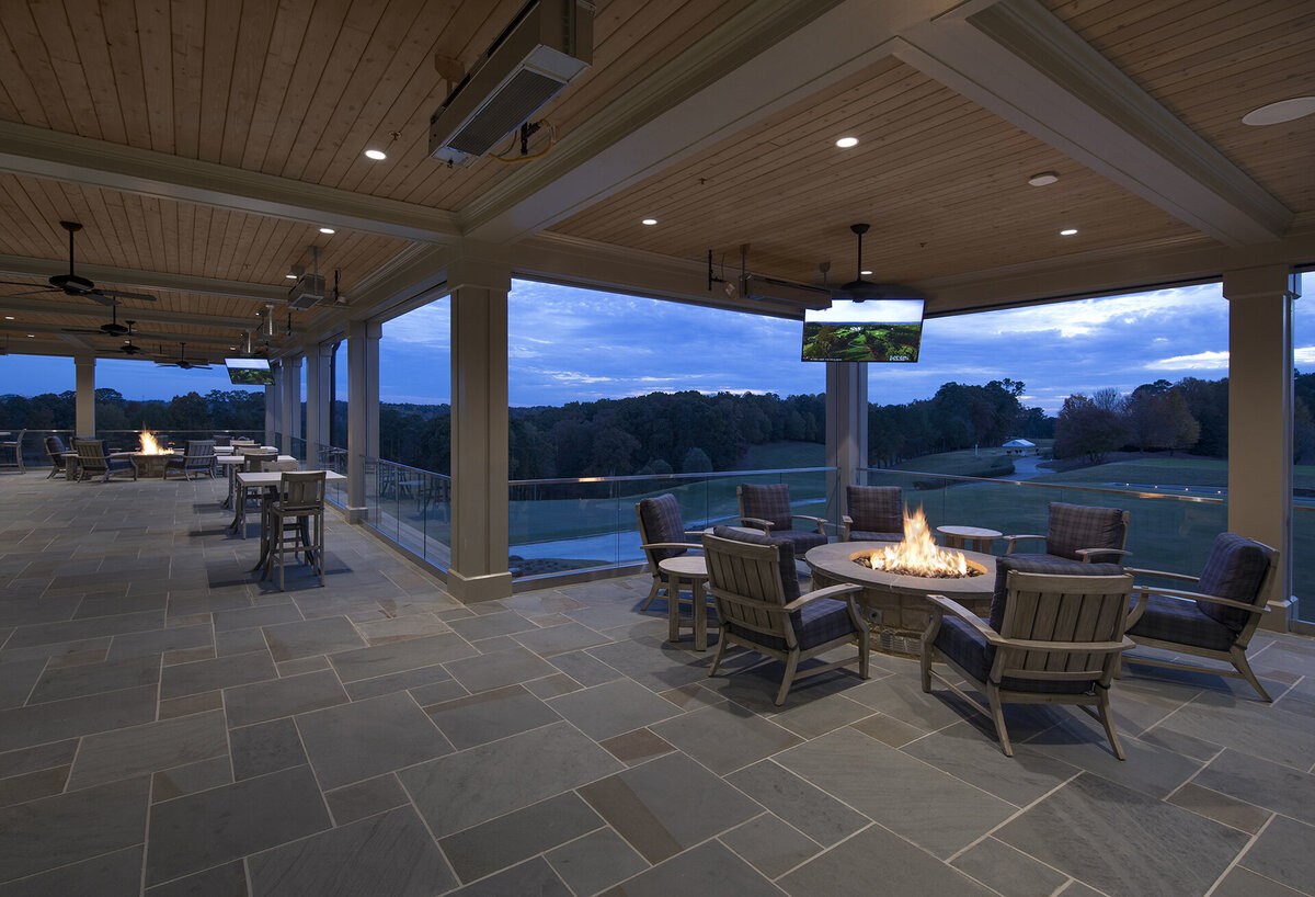 veranda view with fire table at twilight at Cherokee Country Club