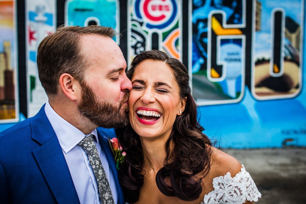 A wedding portrait in front of the Chicago mural in Logan Square.