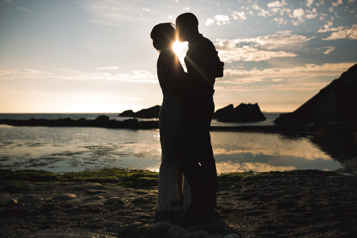 Silhouette of wedding couple at Tunnels Beaches Devon