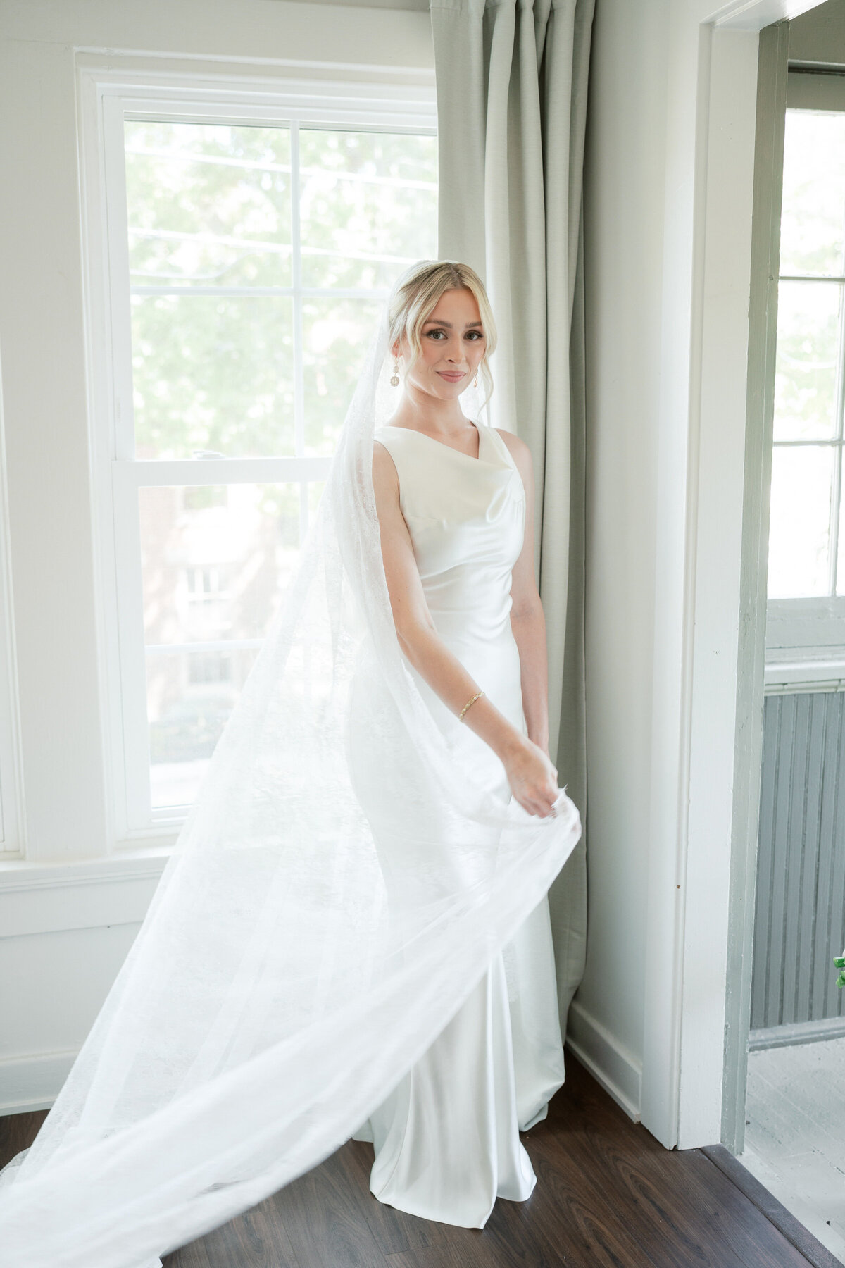 Elegant bridal portrait with long lace veil in Dayton, photographed by a Philadelphia-based wedding photographer.