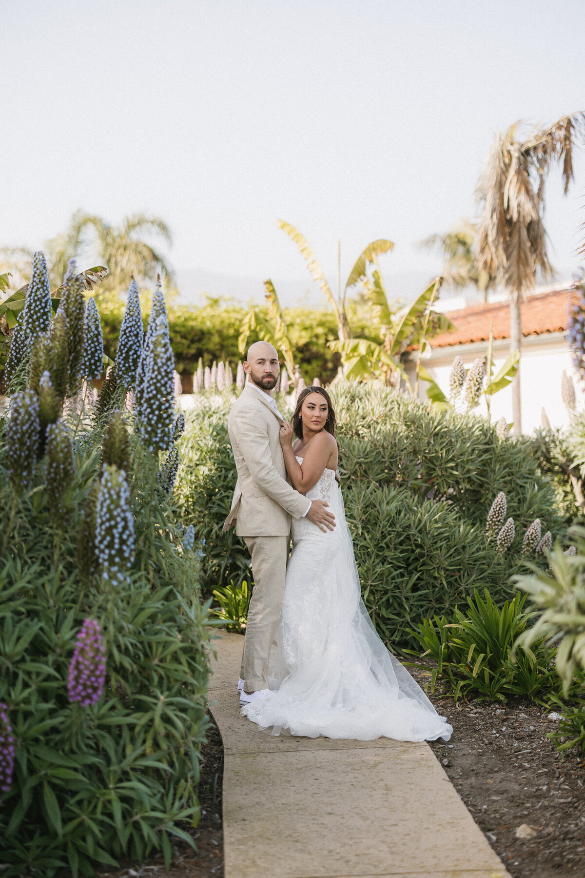 Bride and groom posing for a portrait at Hilton Beachfront Resort Santa Barbara