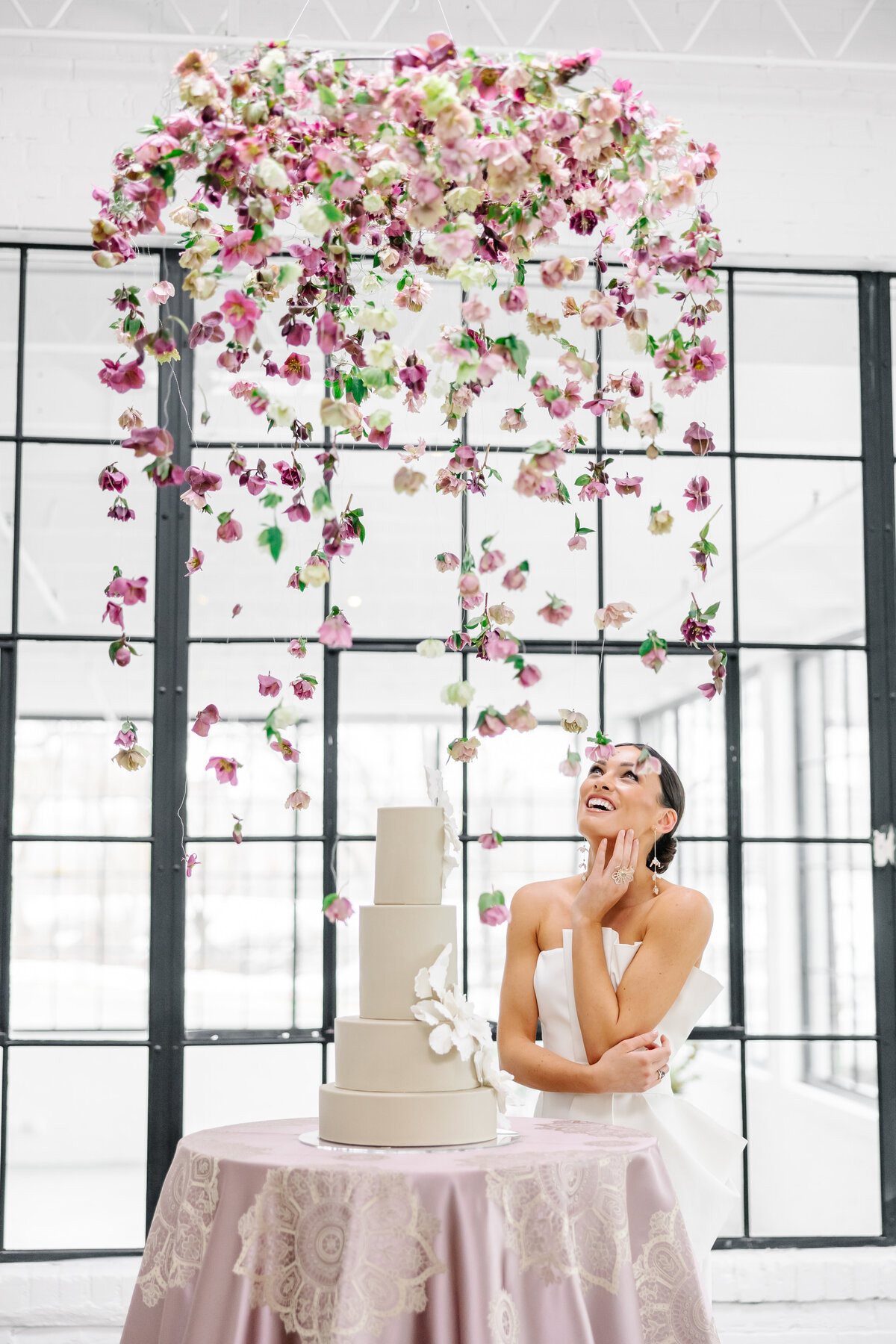 hanging flowers over wedding cake