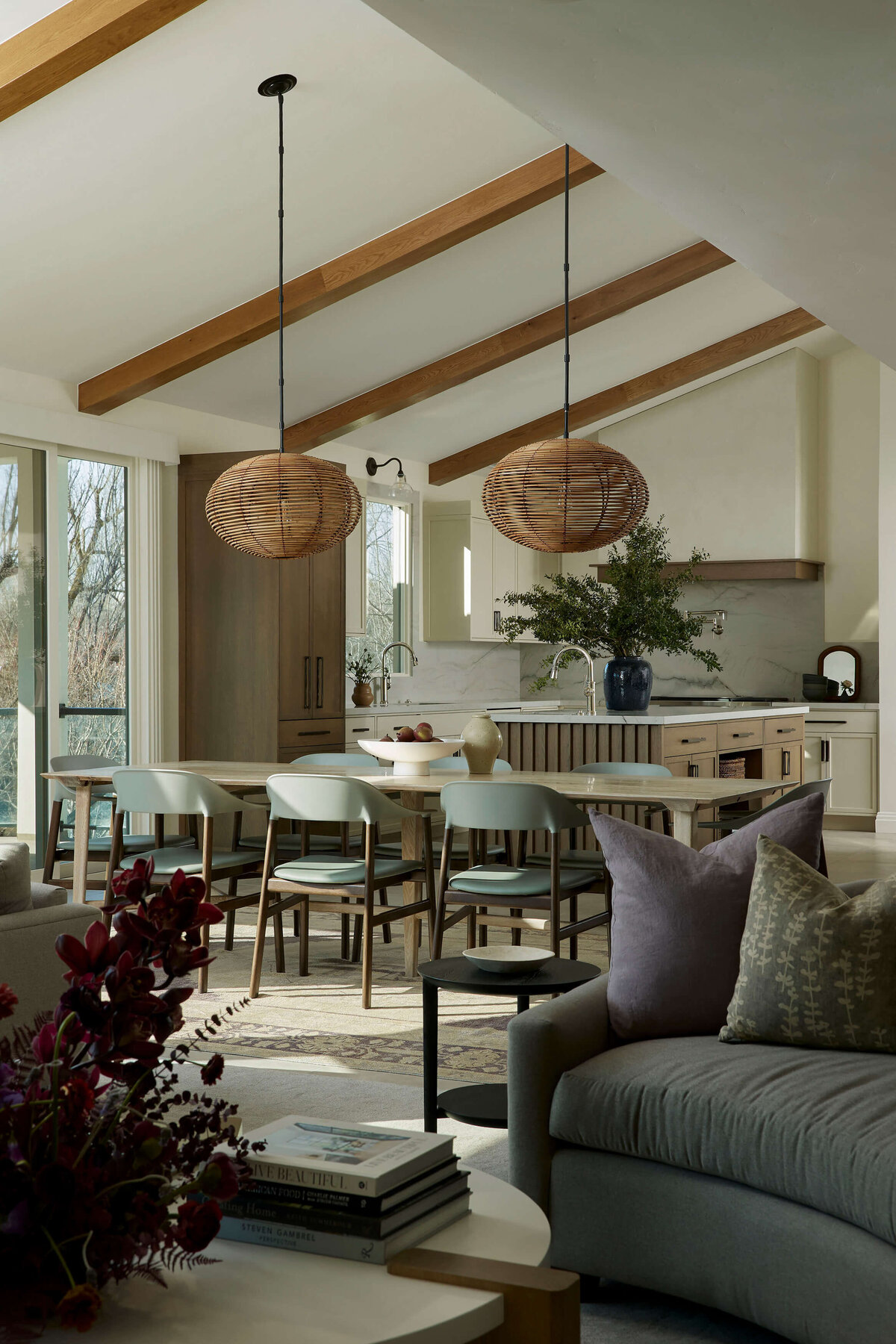 Japandi kitchen detail with woven pendant lights, paneled refrigerator, and organic textures in Wilmington NC remodel.