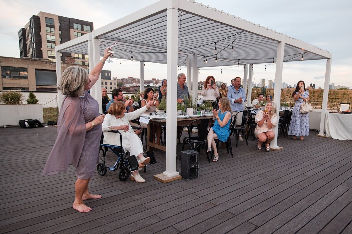 HT-Engagement-Rooftop-Hoboken- Deanna & Jerry toast(204)