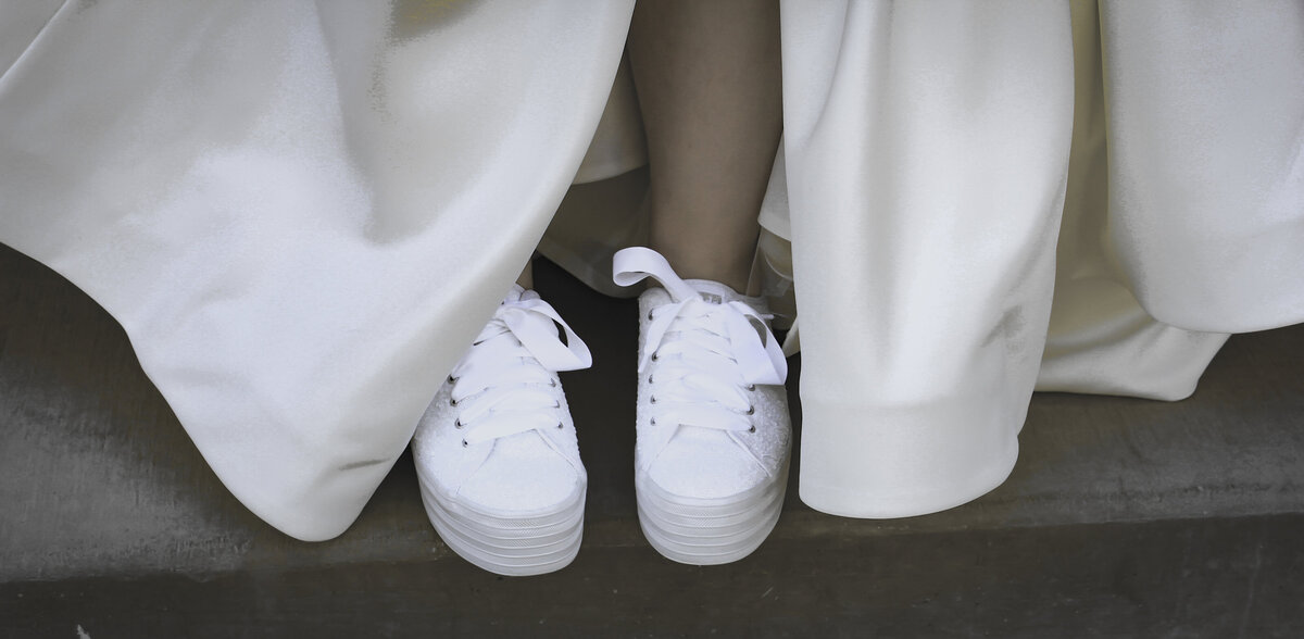 Bride wearing Converse  tennis shoes