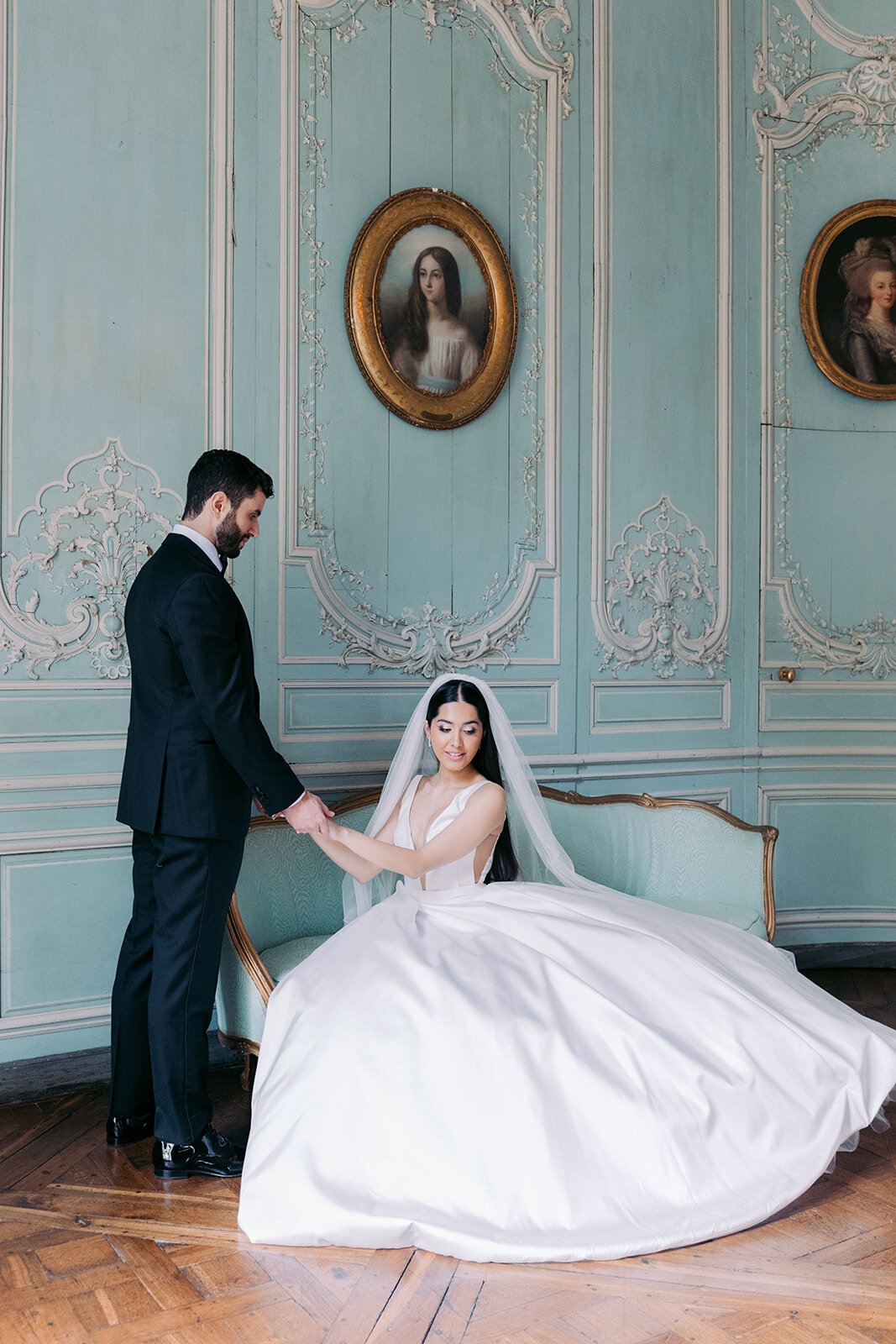 Groom holding his wife's hand