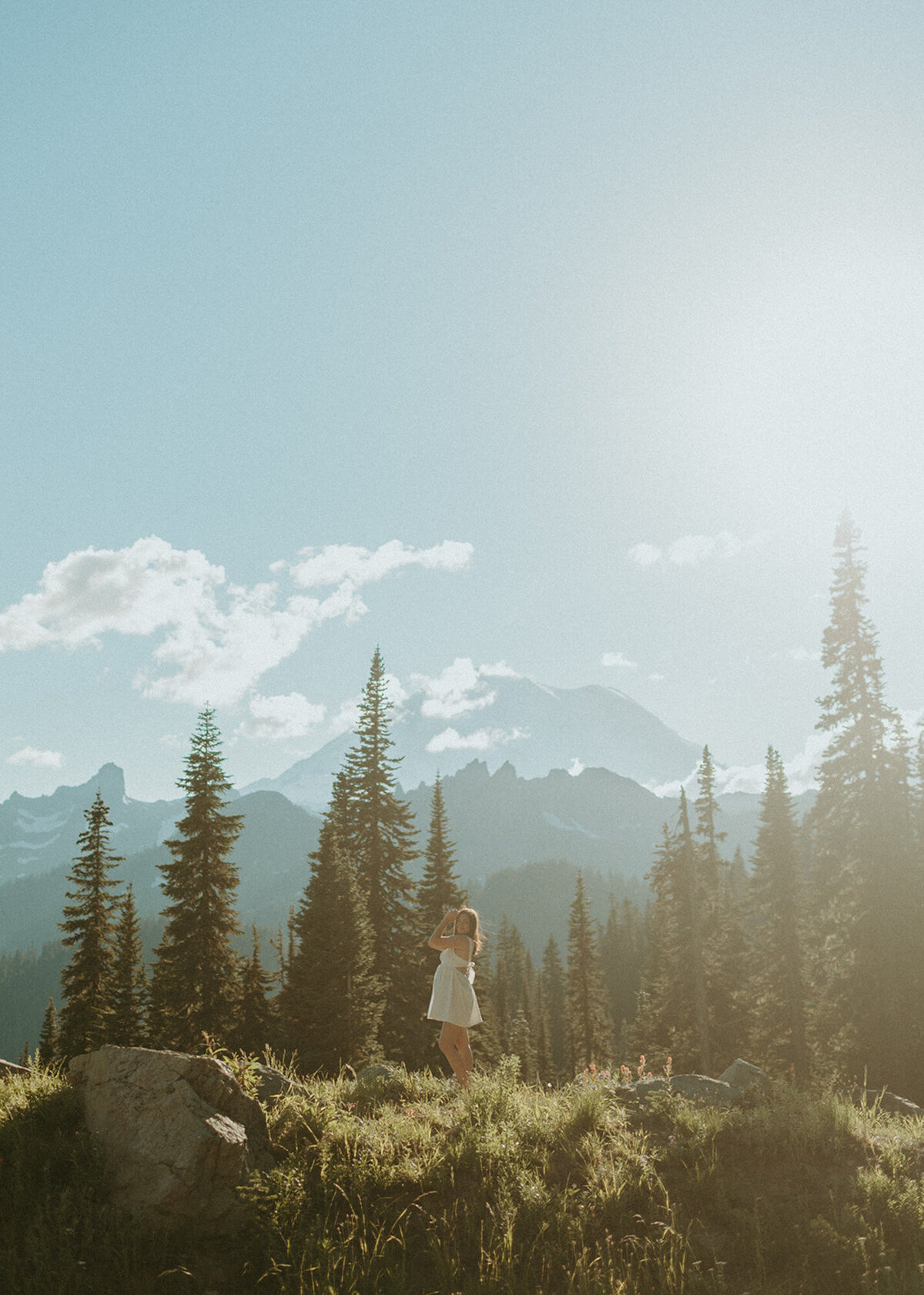 girl posing in front of mountainside