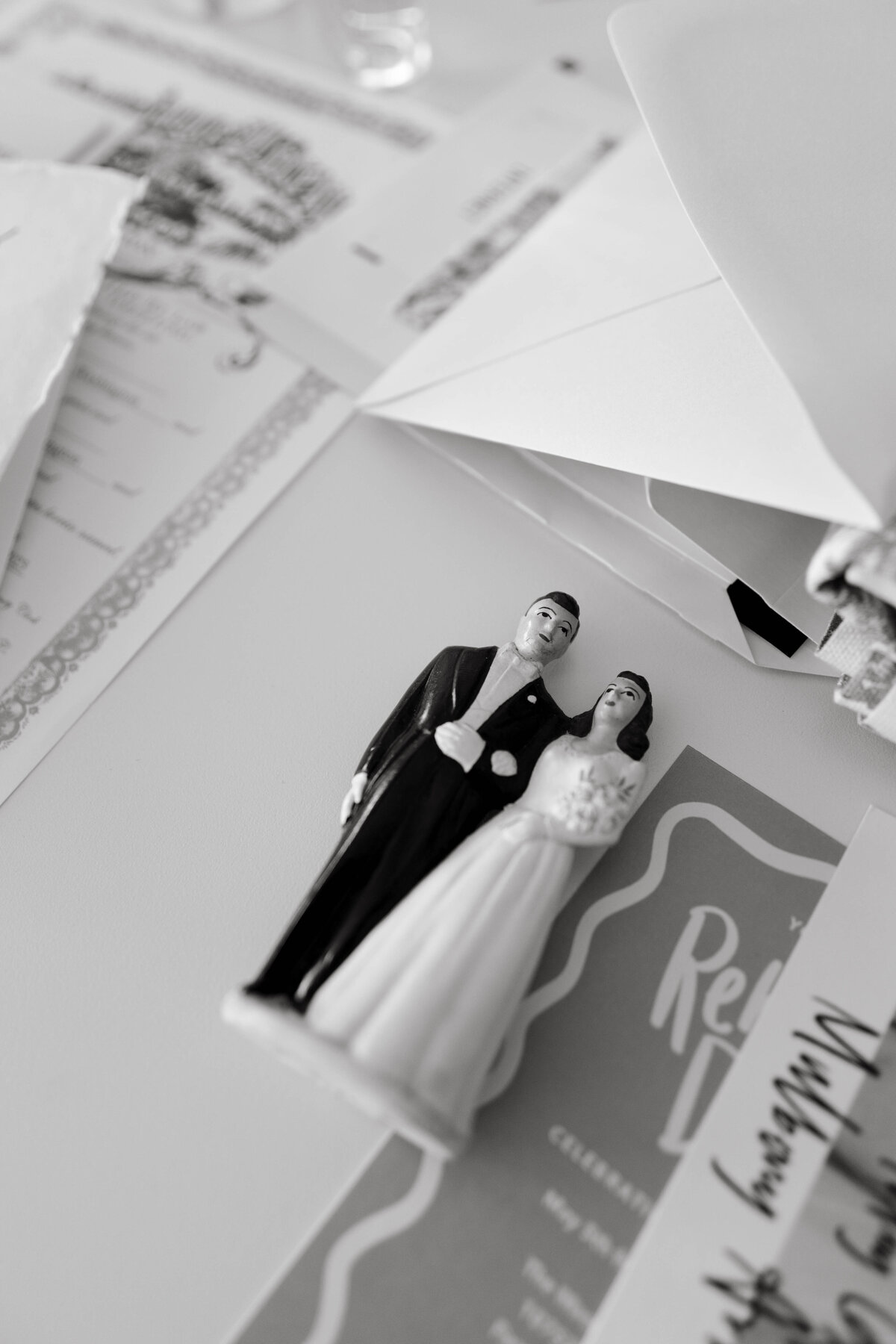 Vintage wedding cake topper detail photographed in black and white