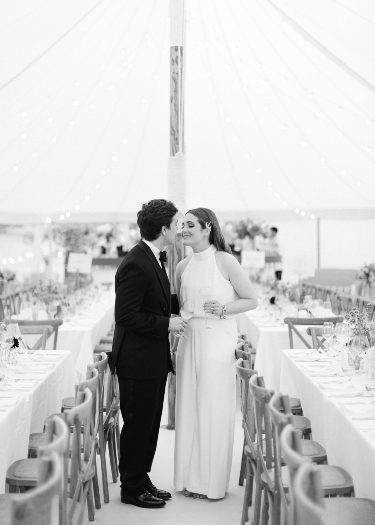 chloe-winstanley-weddings-bride-groom-kiss-sailcloth-tent