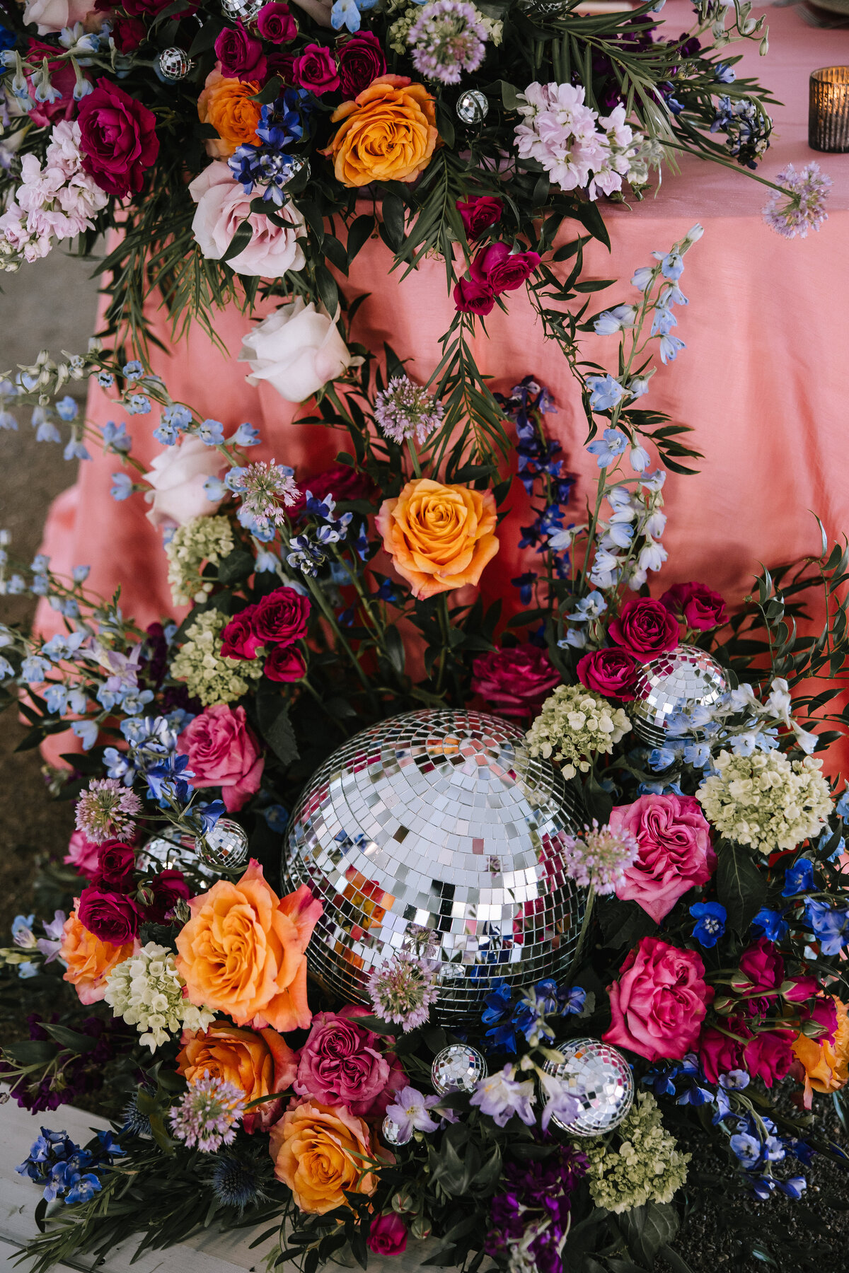 Wedding florals around a disco ball designed by Allison McGeary.