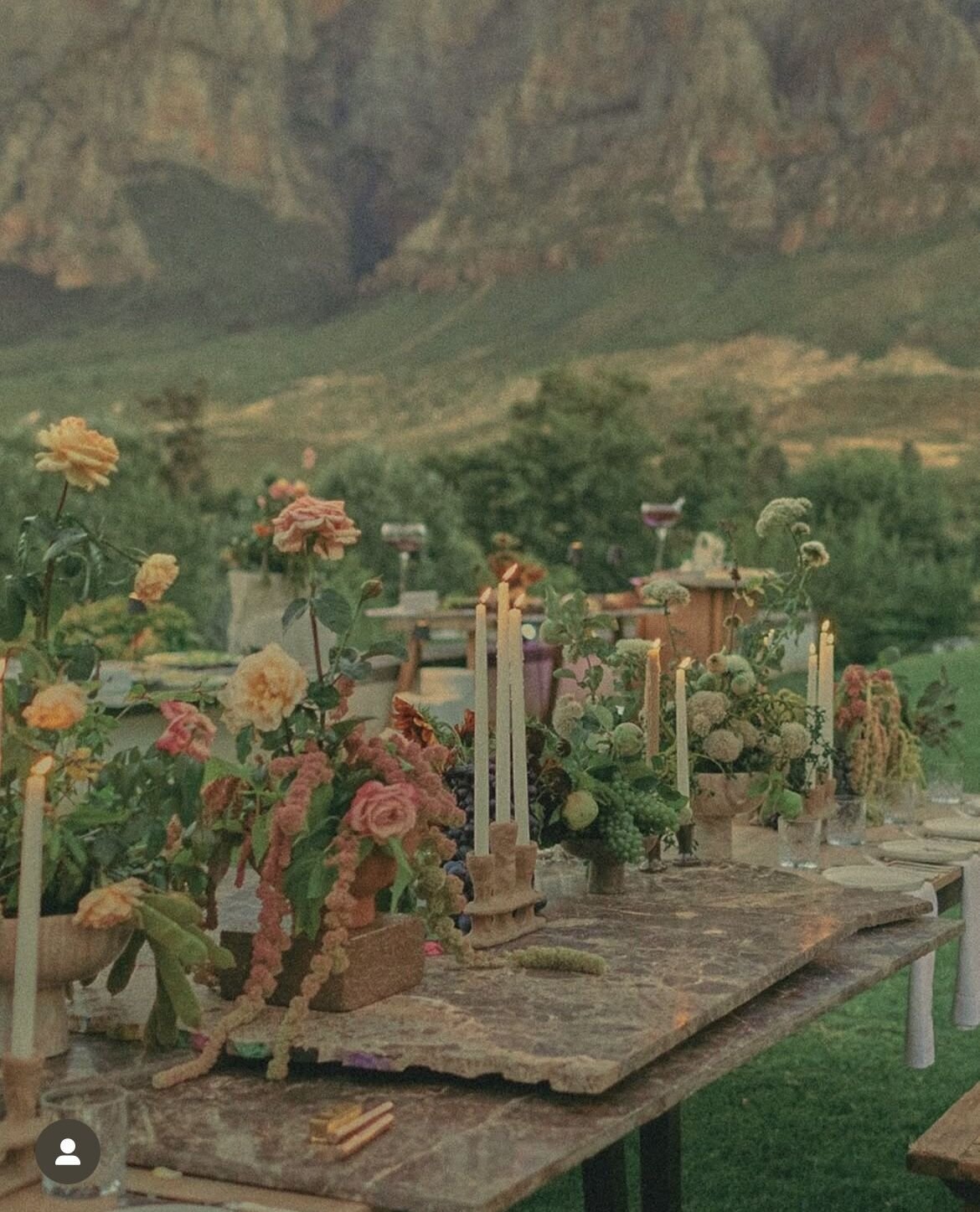 Textured tablescape with sculptural florals in warm tones, styled as a design reference for Wrightsville Manor weddings