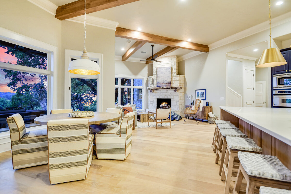 kitchen island and breakfast table in open plan living room