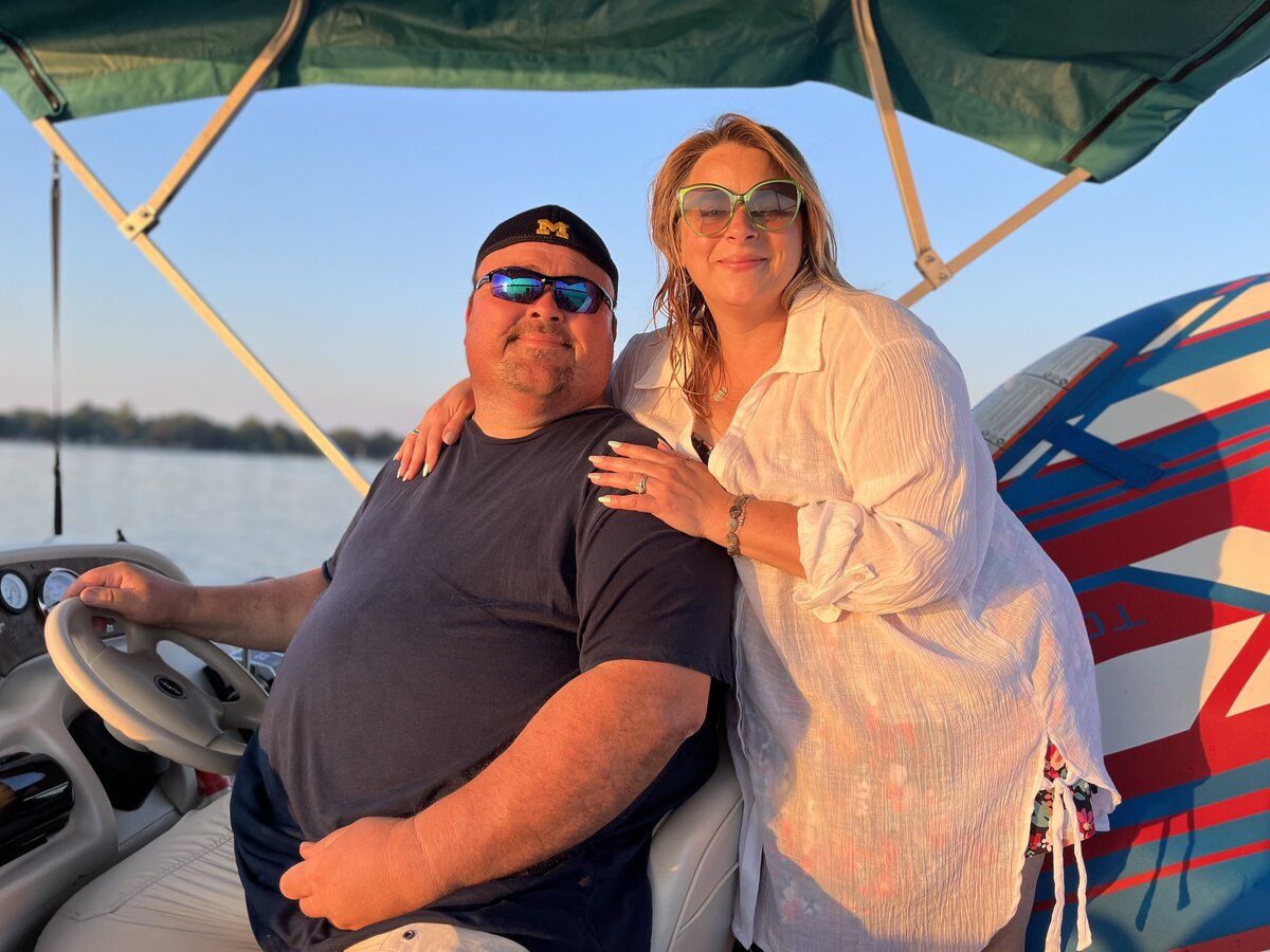man on a pontoon rental on sister lakes michigan