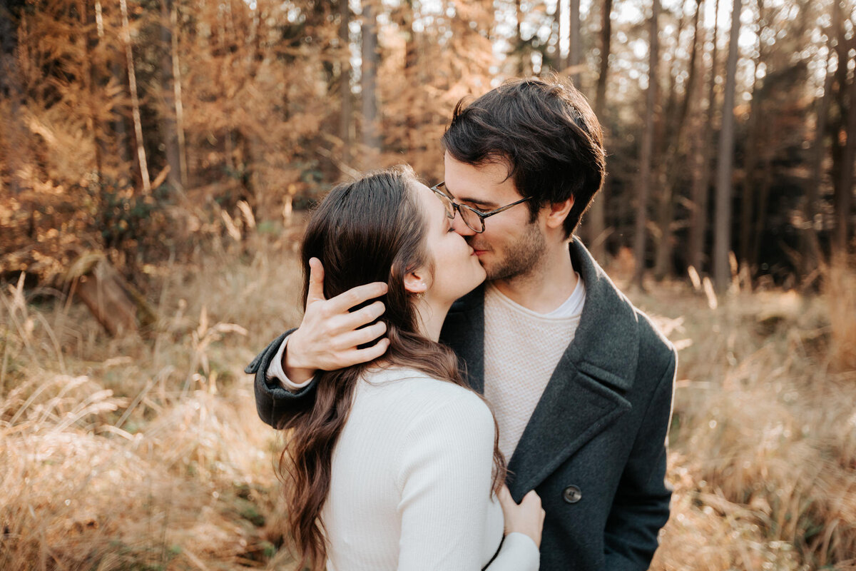 couple kissing in German forest