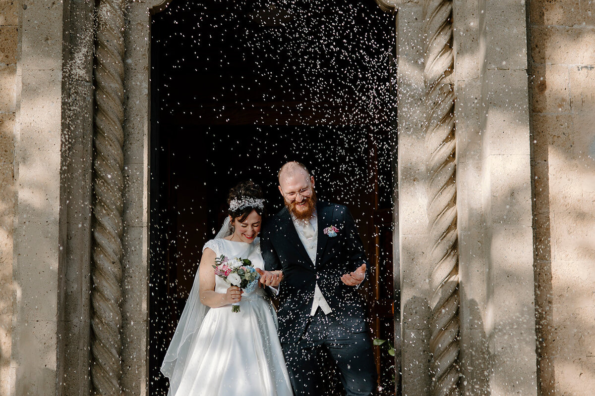bride and groom standing together smiling