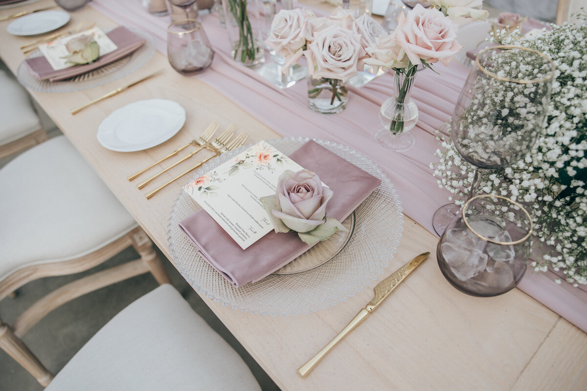 Luxurious floral themed wedding place cards on crystal plates