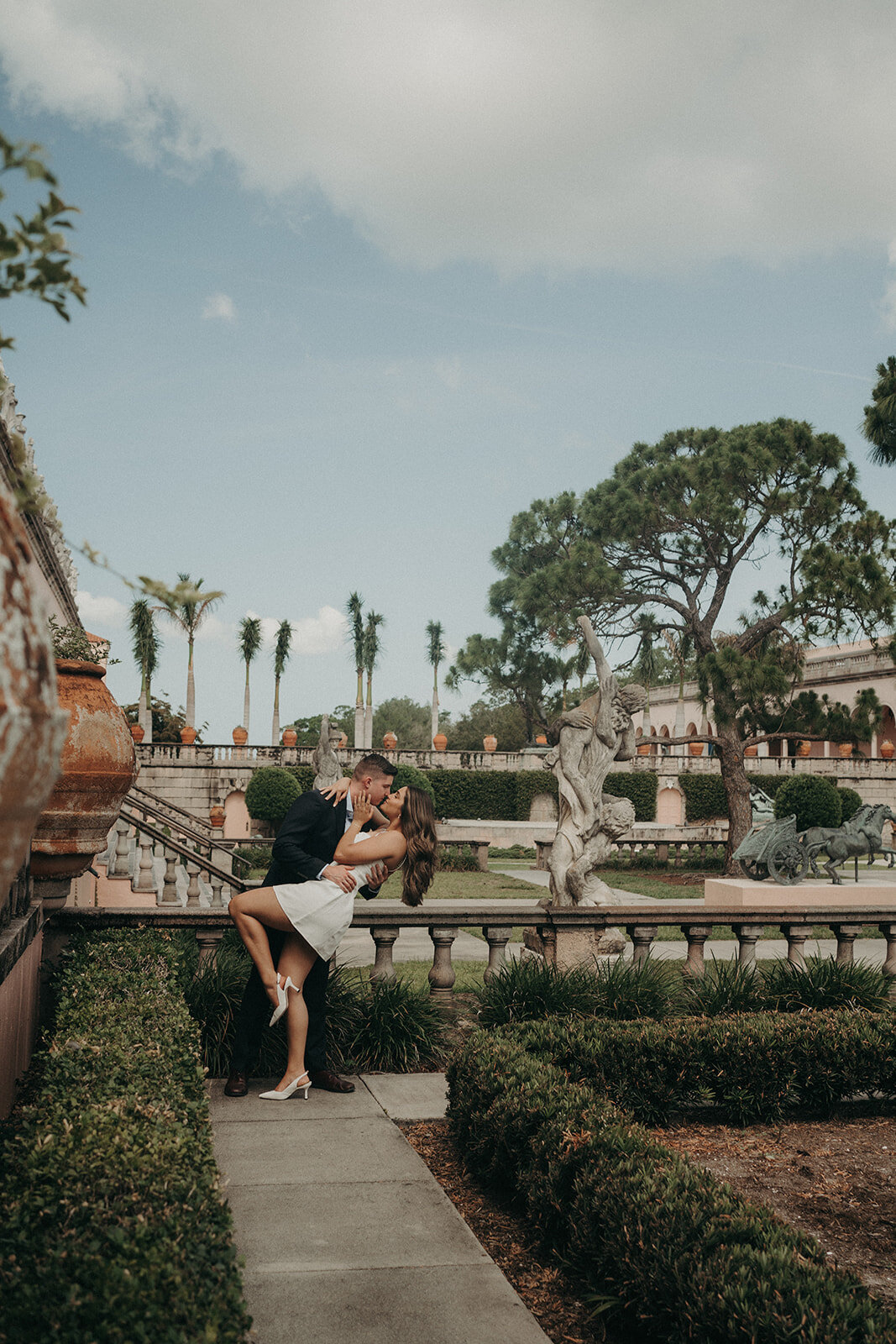 engaged couple dip and kiss