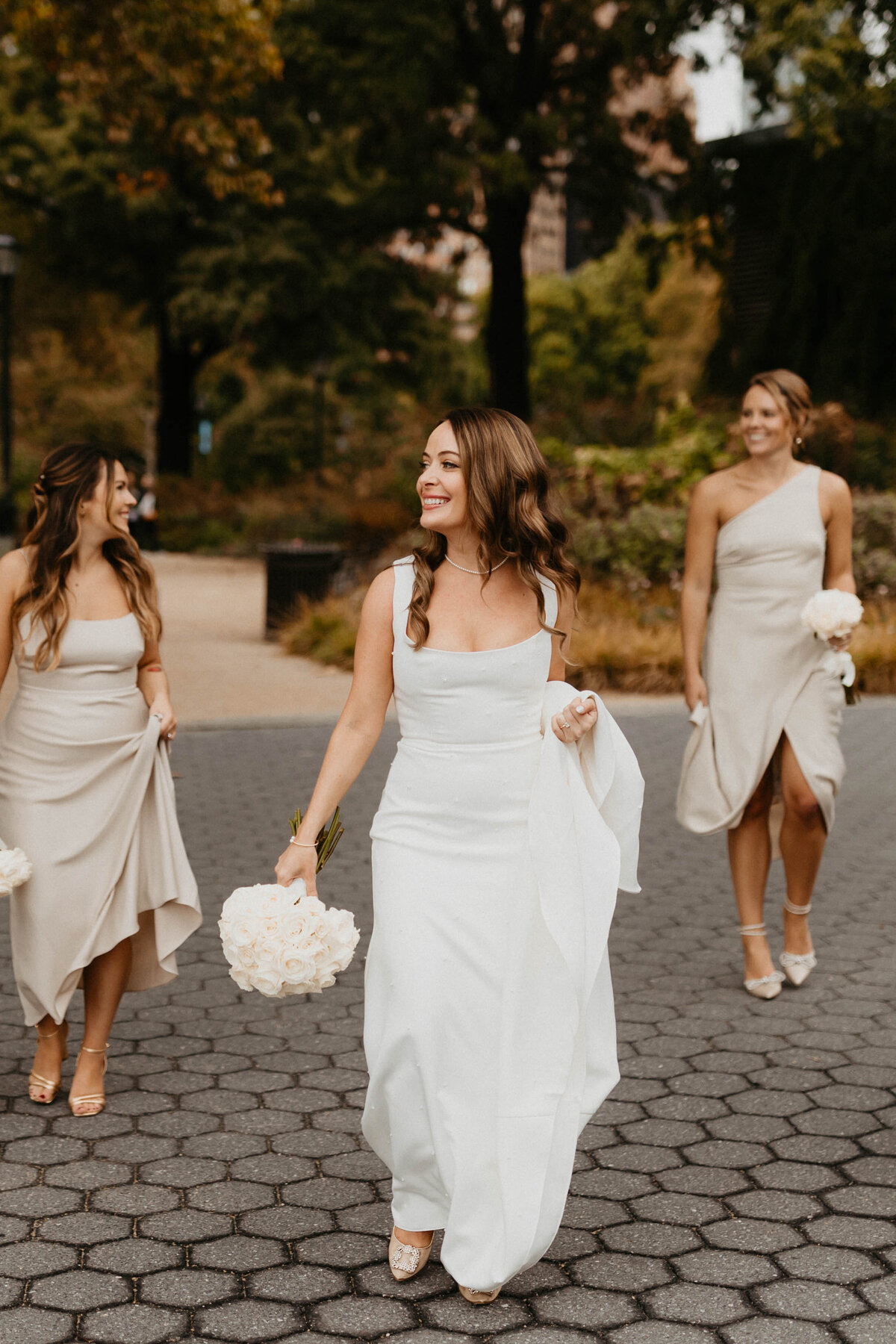 Bride walking to Ceremony with her bridesmaids in New York City
