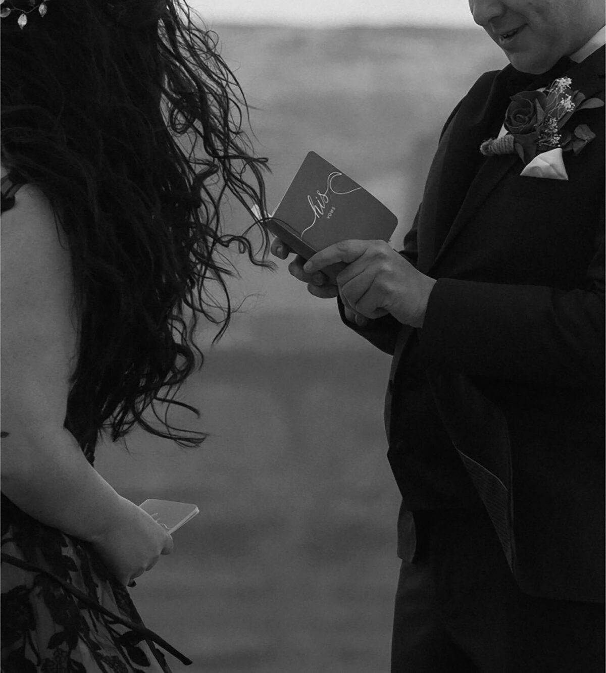private elopement couple read vows to each other among the Moab desert scenery 
