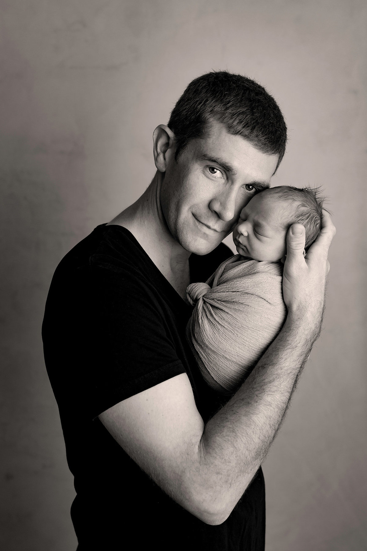 dad and baby newborn in kalispell  photographer studio