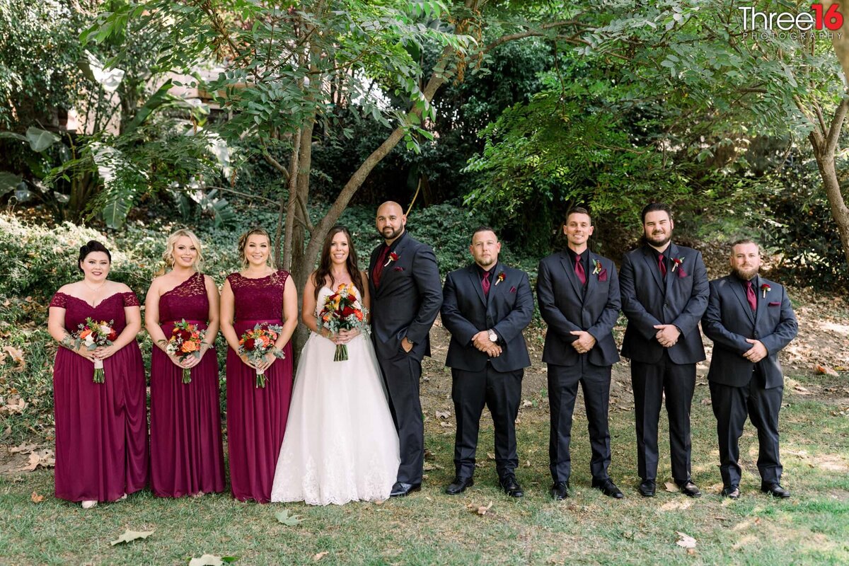 Bride and Groom pose for photos with their wedding party