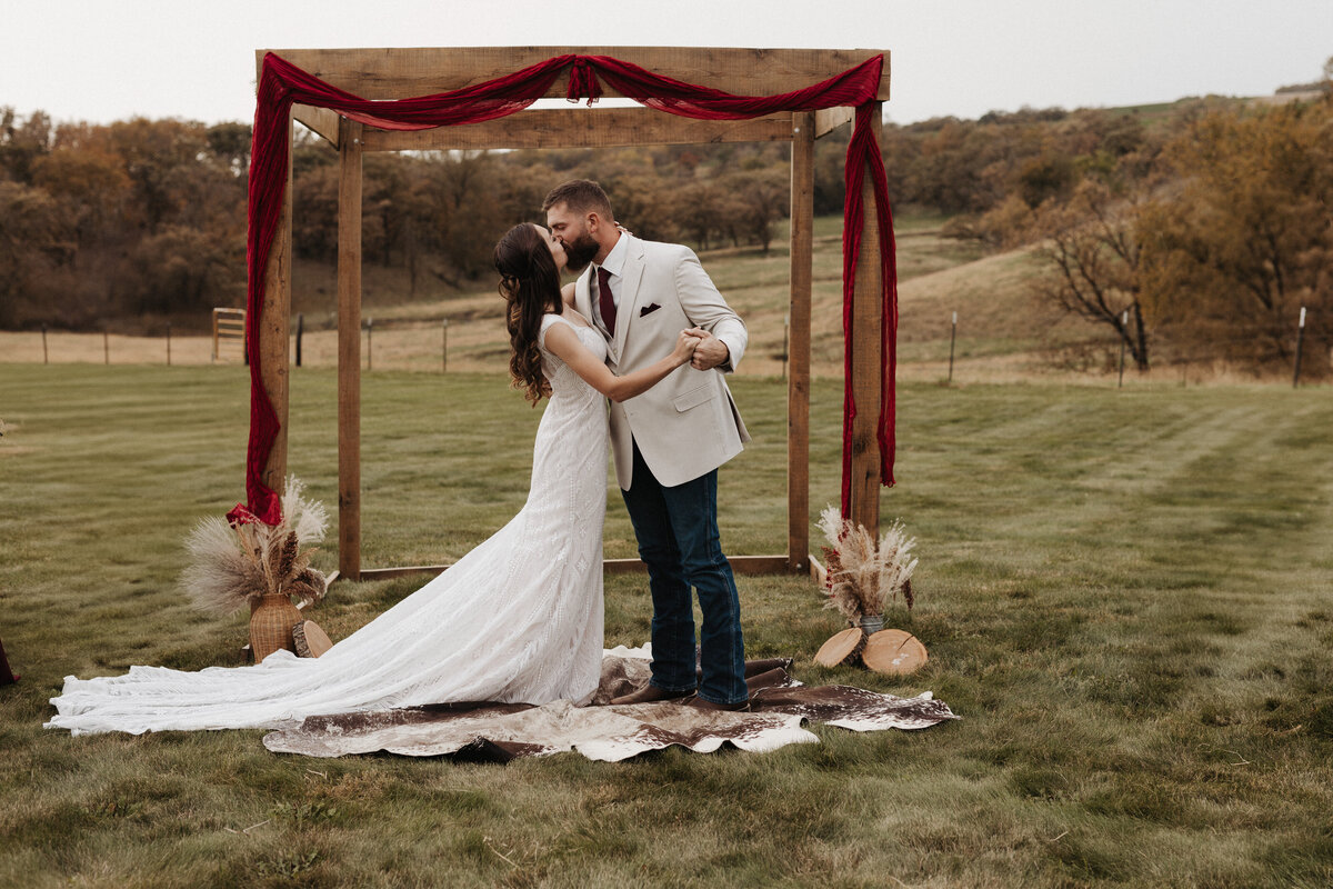 Montana Bride and Groom first kiss on family ranch 