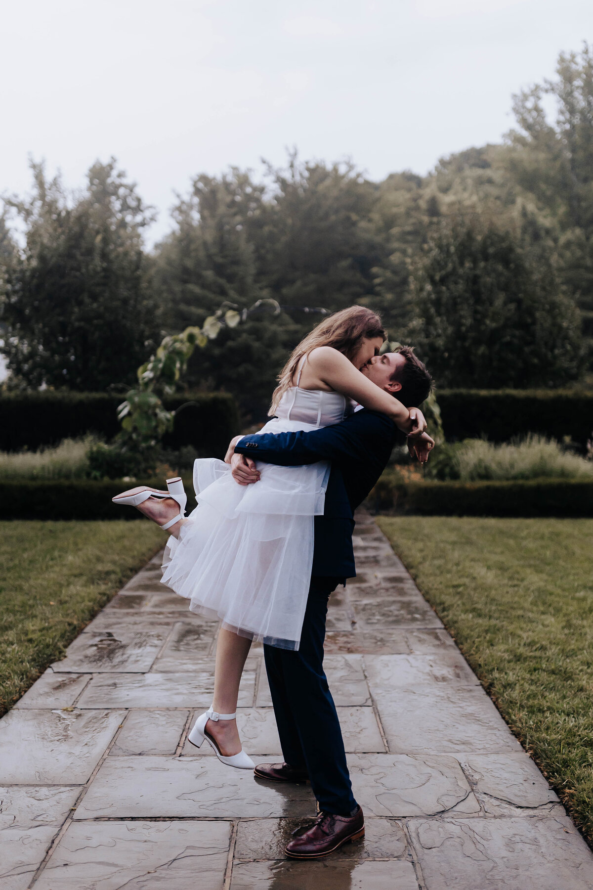 Destination elopement photographer captures bride and groom hugging after elopement