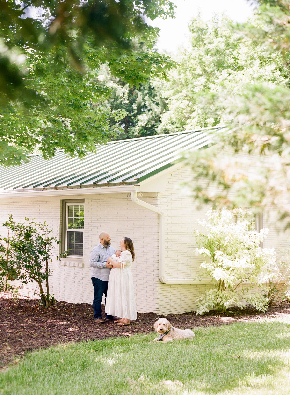 Newborn session in the backyard of a Mebane NC home. Image by Raleigh newborn photographer A.J. Dunlap Photography.