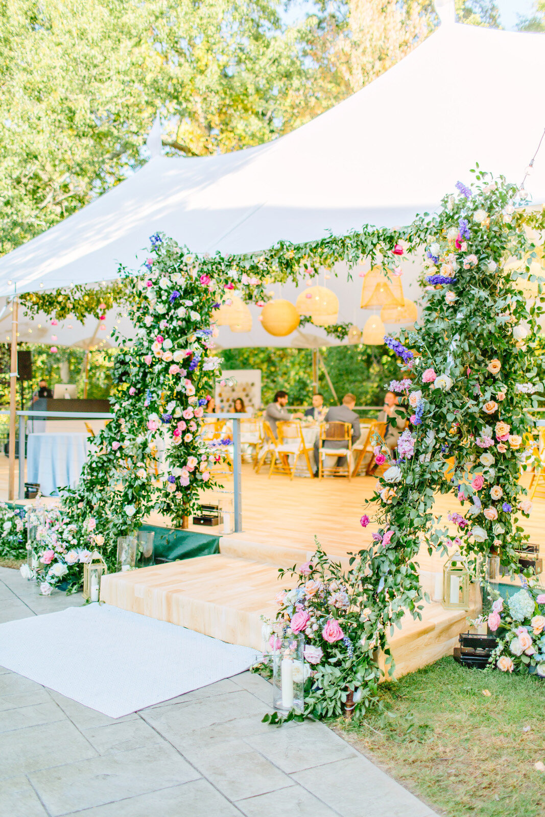 Kate-Murtaugh-Events-private-estate-tented-wedding-planner-rattan-lighting-floating-flowers-greenery-arch-MA