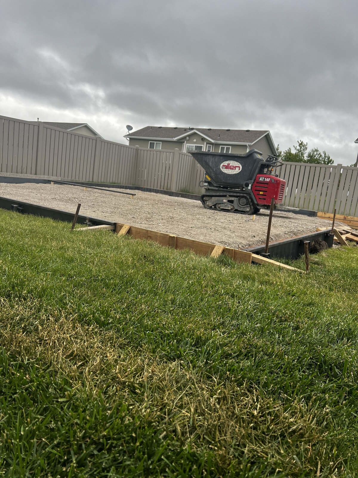 concrete slab and tools in backyard
