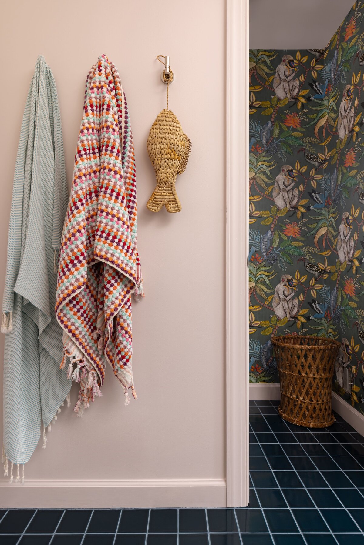Cheeky jungle monkey wallpaper in water closet of a Northern Virginia primary bathroom remodel