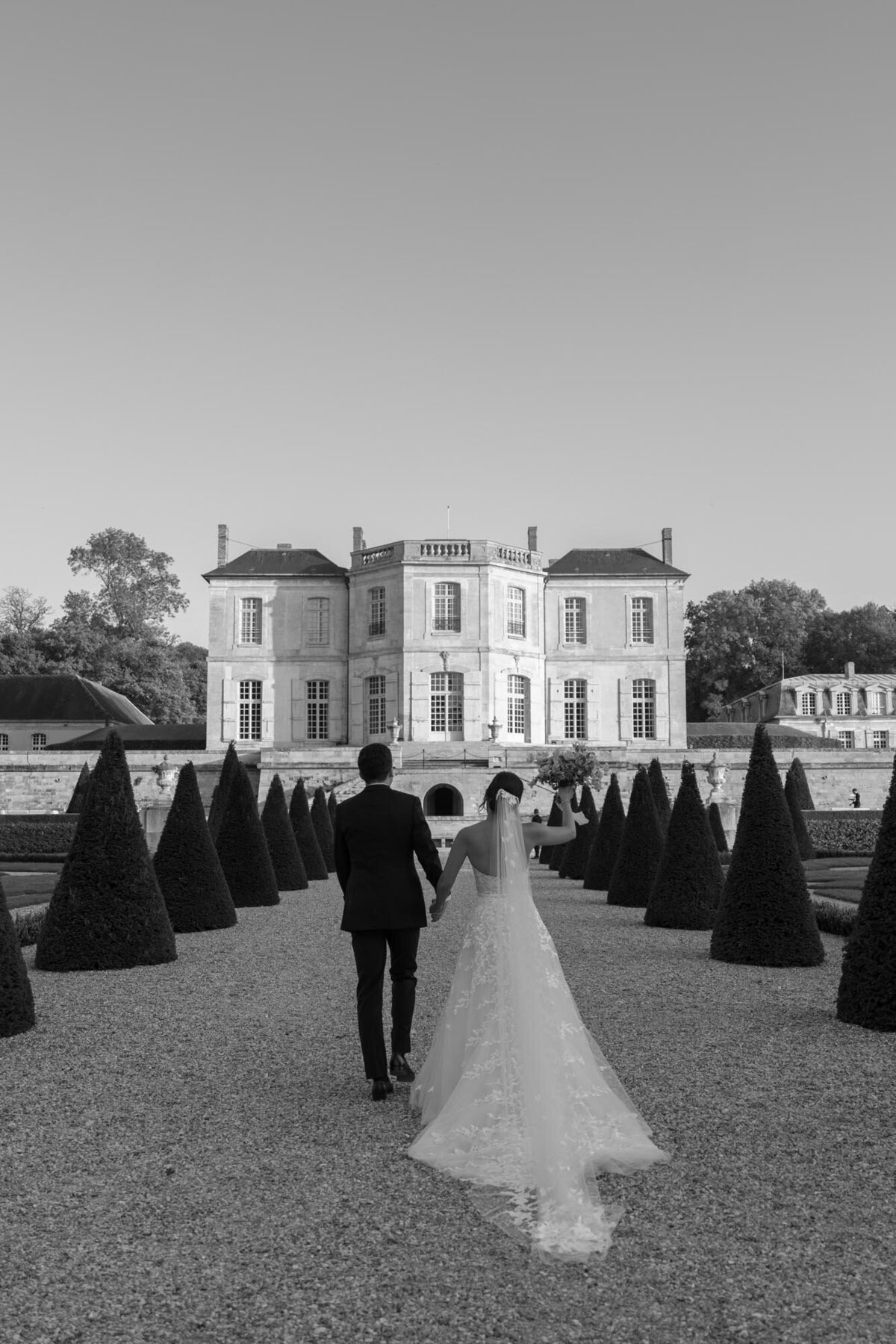 the couples walking  in the direction of Chateau de Villette