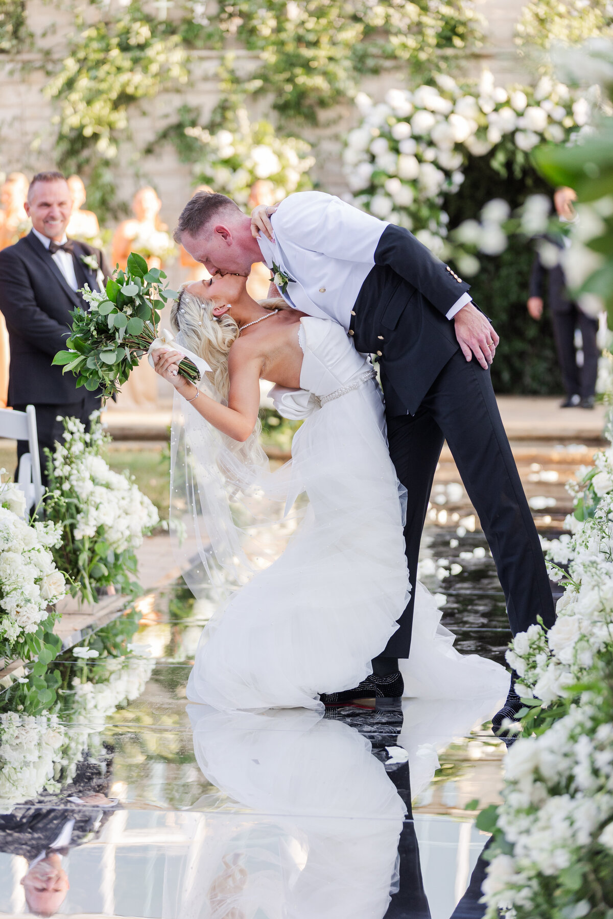 Jaz-kissing-ariel-as-he-dips-her-back-recessing-up-the-aisle