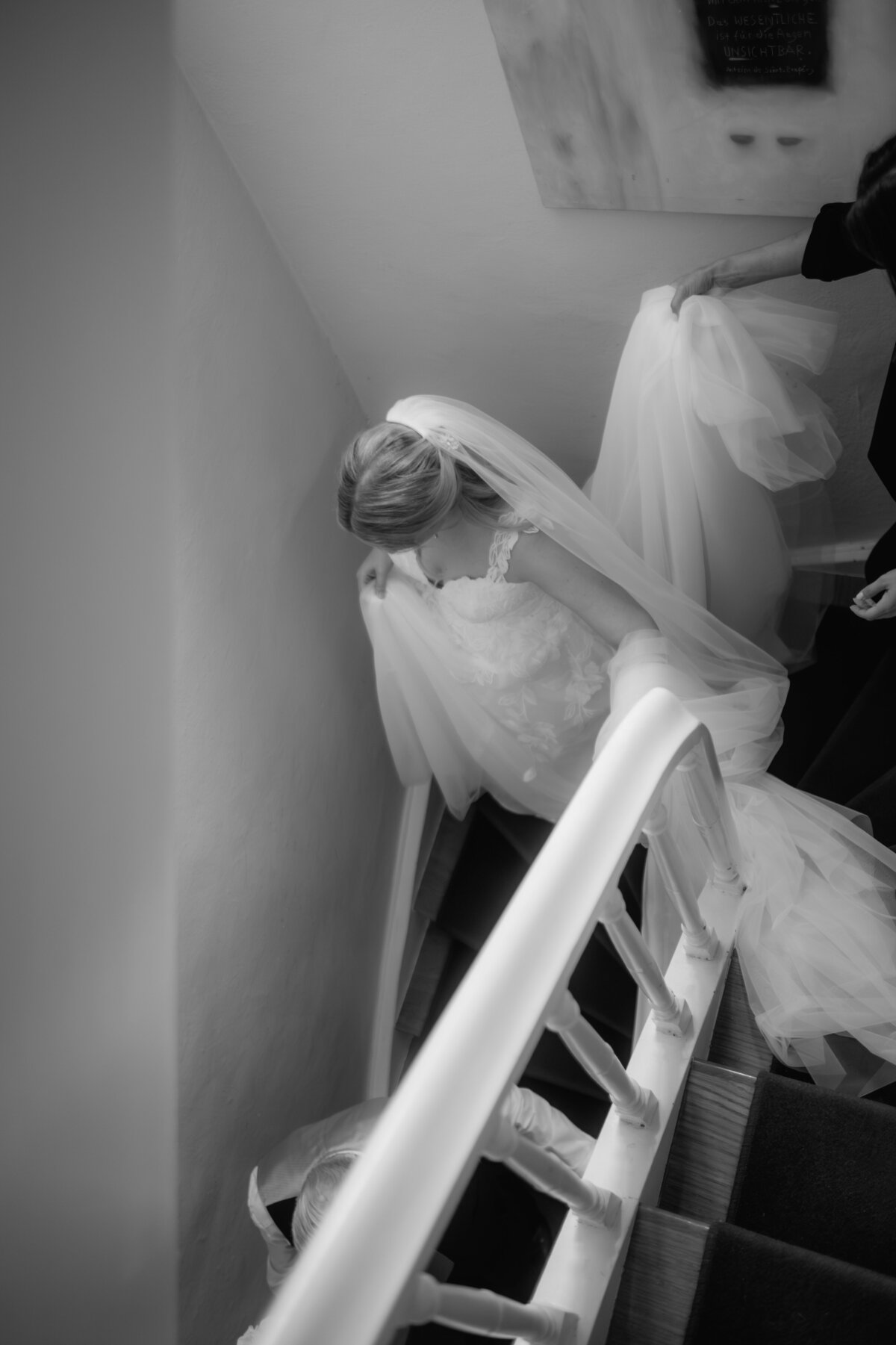 On her way to the wedding, the bride goes down stairs.