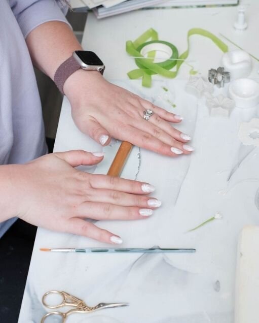 gumpaste basics - behind the scenes making sugar flowers with kelsie Delisle rolling out petals