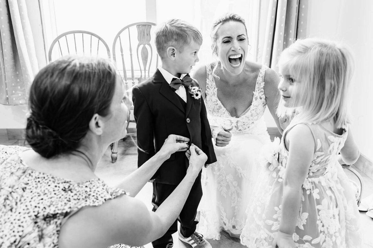 Bride laughing with flower girl and ring bearer, The Silver Knot, Ronan