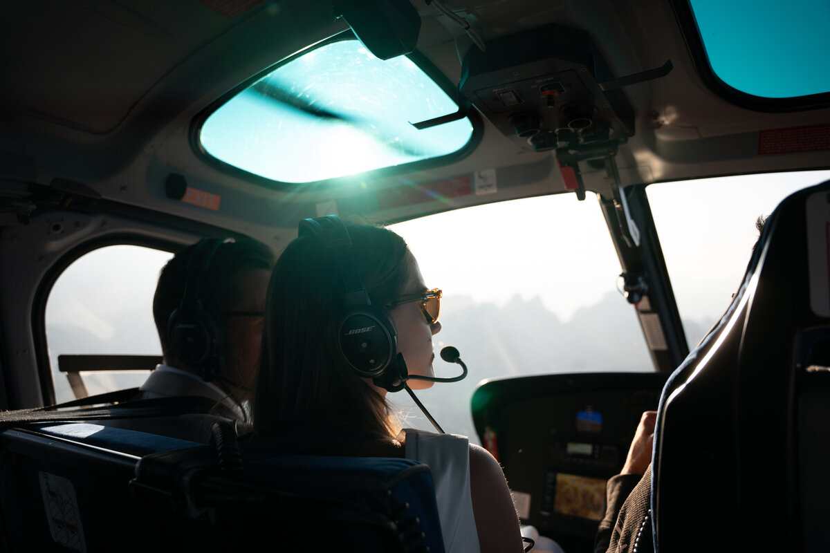 Helicopter flying over Dolomites peaks