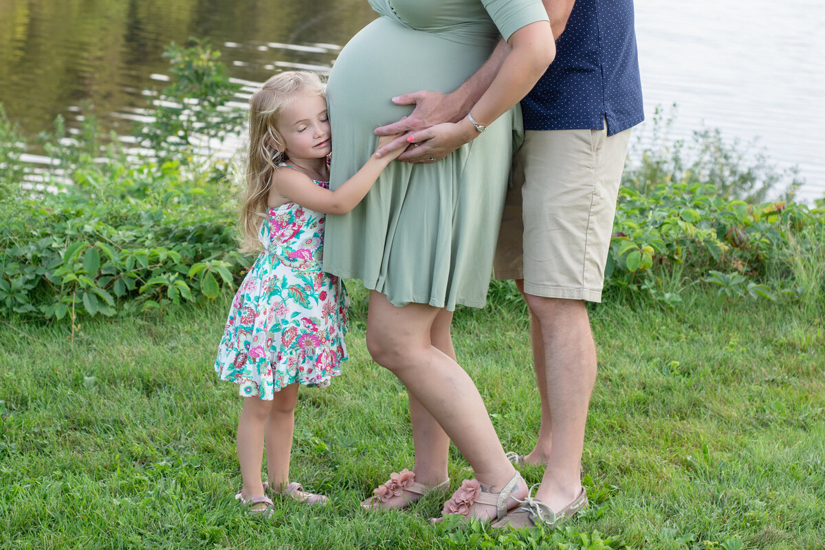 Pregnant mother with daughter and husband
