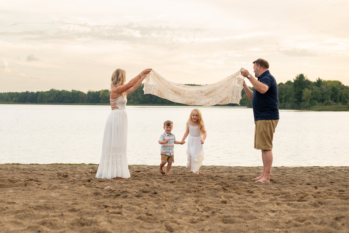 family-playing-at-the-beach