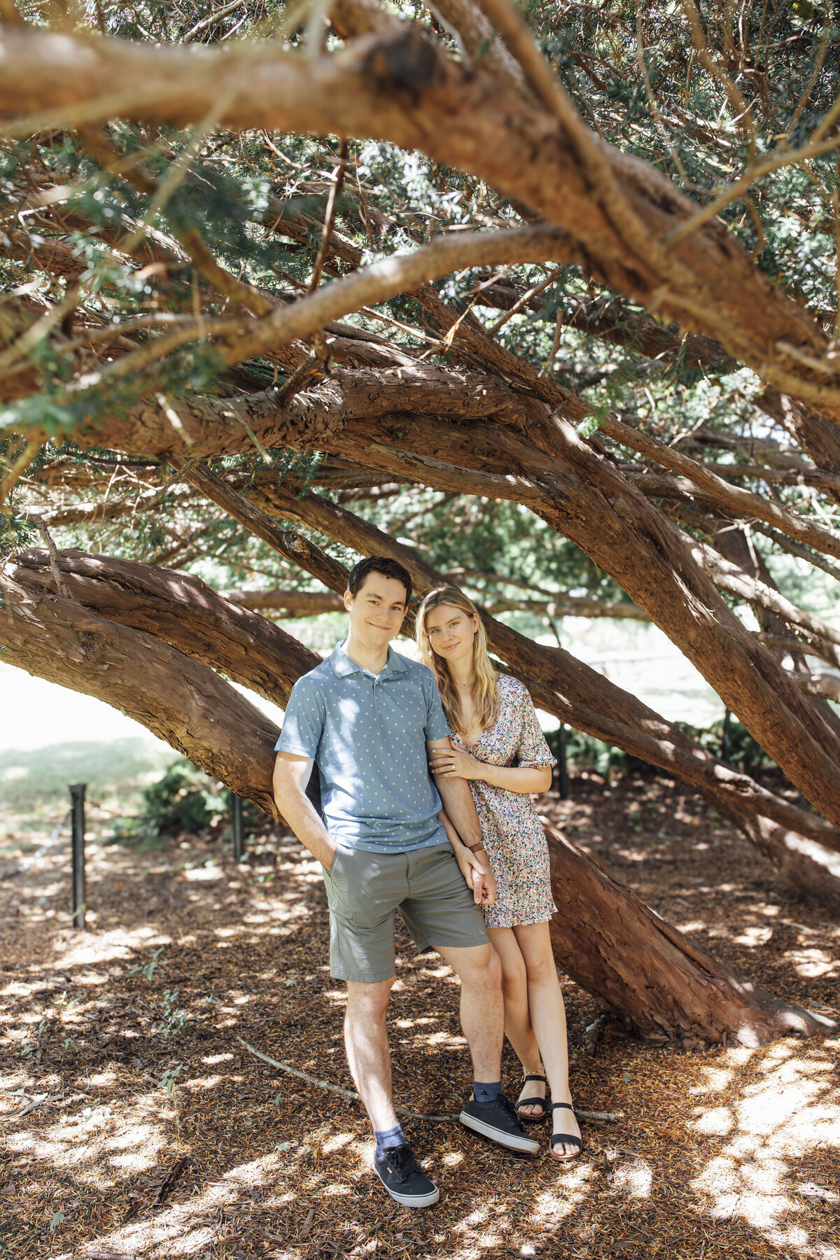 Proposal Photos | Groom-to-be proposing in the gardens surrounded by flowers and greenery at New Jersey Botanical Gardens | Ringwood, New Jersey
