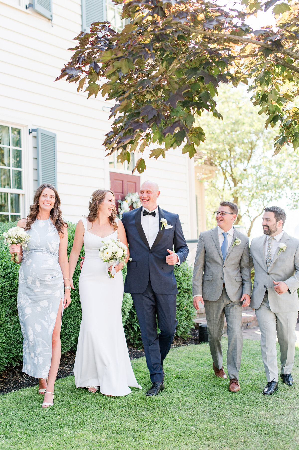 small wedding party photo of them walking