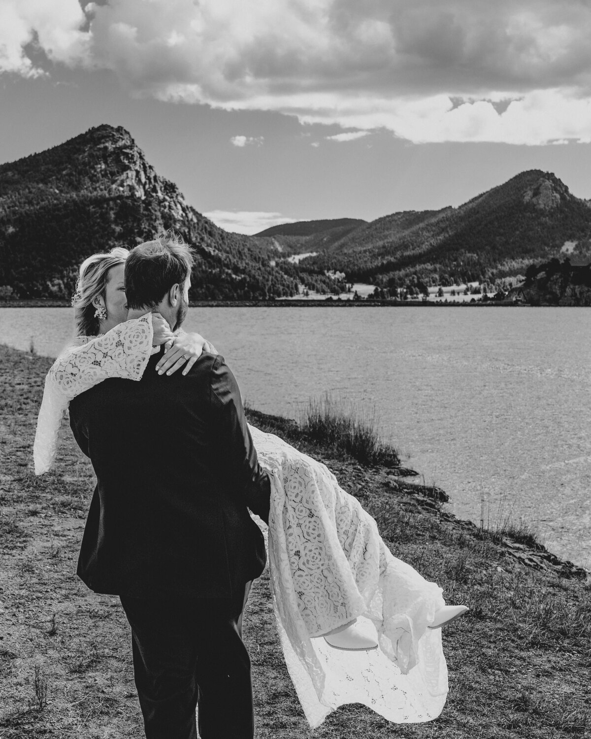 denver colorado wedding photographer - groom holding bride near water