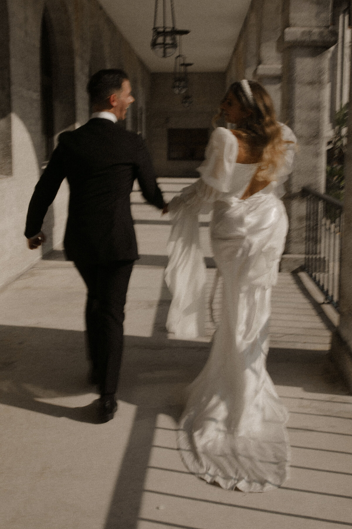 couple running on their wedding day