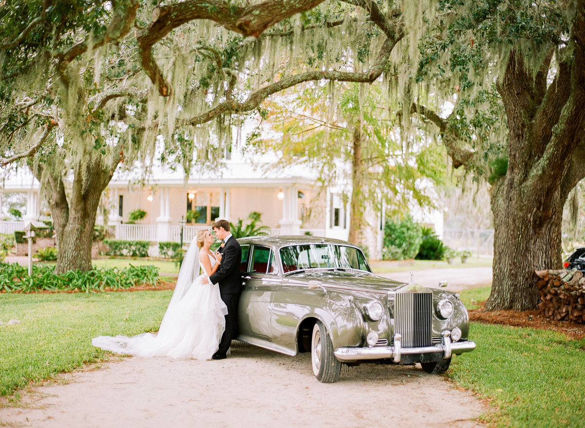 Bride and Groom Newlywed Charleston Wedding Couple Portraits Spanish Moss Oak Trees 1961 Rolls Royce